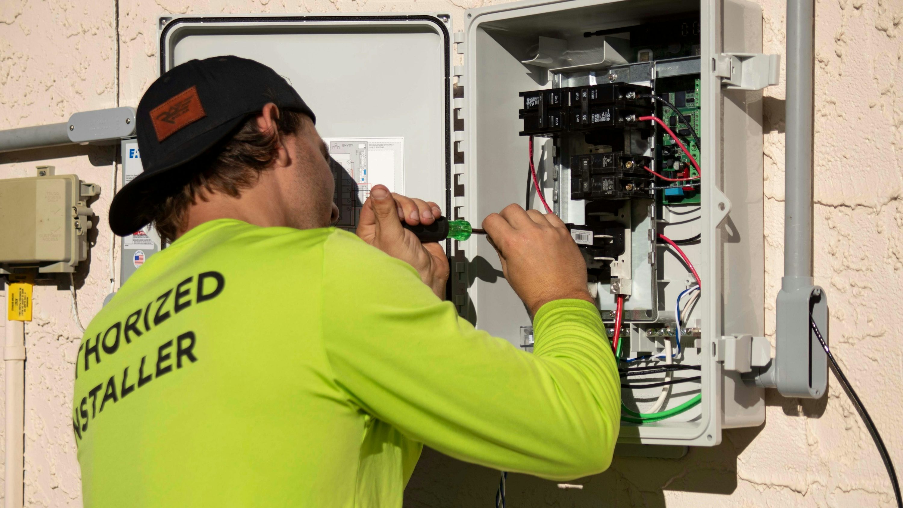 Professional electrician performing electrical work